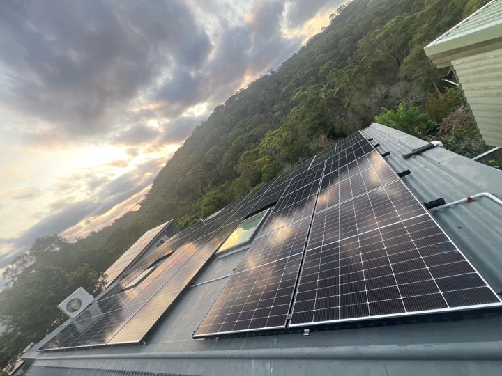 Solar array on a hillside home at sunset, Sydney.